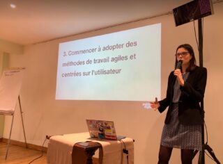 Emily presenting Meeting Gordon, a senior civil servant in Kigali